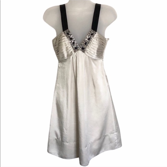 BCBGMaxAzria Dresses & Skirts - BCBGMaxAzria Ivory Satin Dress with Black Straps and Embellished V-Neck